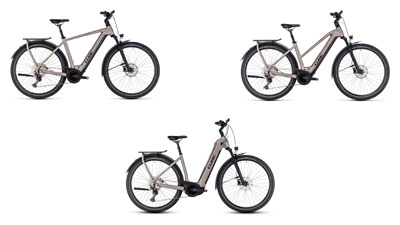 Zu sehen sind drei graue Cube Kathmandu Hybrid E-Bikes, jeweils mit einem Diamant-Rahmen, ein Trapez-Rahmen und ein Tiefeinsteiger-Rahmen.